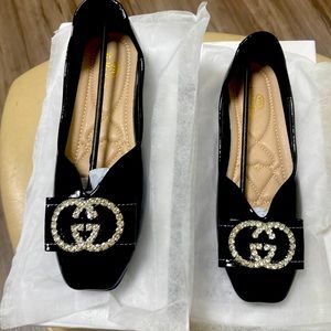 New in box Women’s Black patent and embellished GG buckle and bow (size 40)